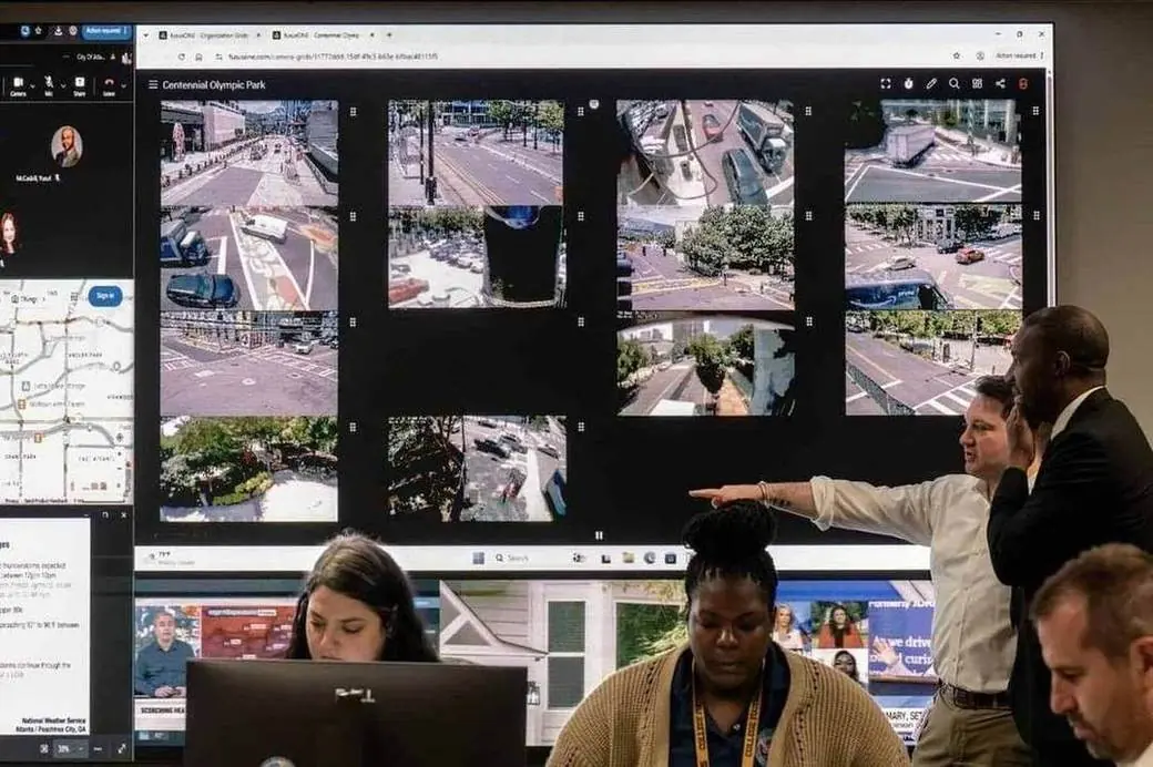 City staff monitor live camera grids of Atlanta intersections inside the Integrated Command Center