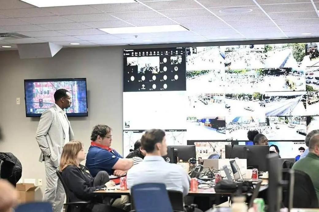 Staff monitor live camera feeds inside Atlanta's Joint Operations Center