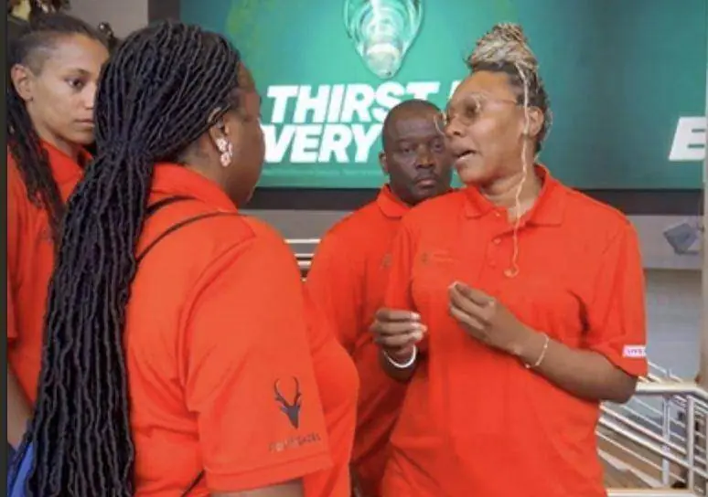 Nightlife Ambassadors in orange polos assisting visitors in an Atlanta entertainment district