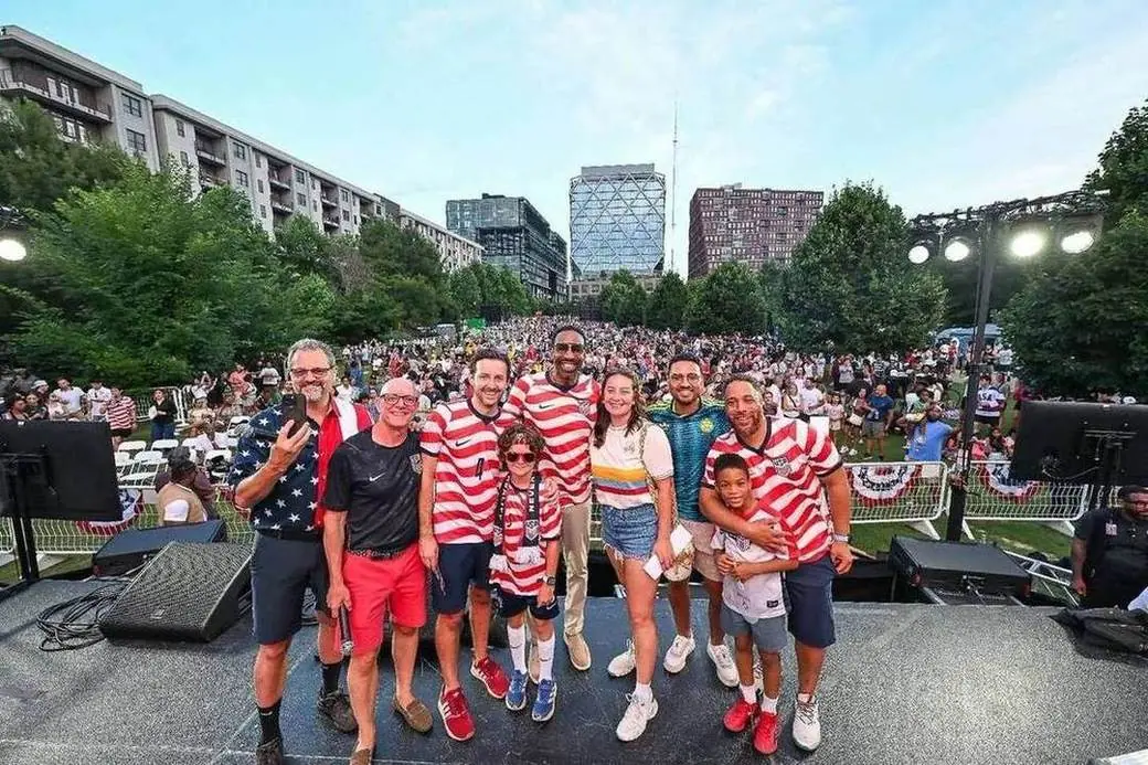 Fans gather on stage at the O4W Soccer Kickoff Festival watch party
