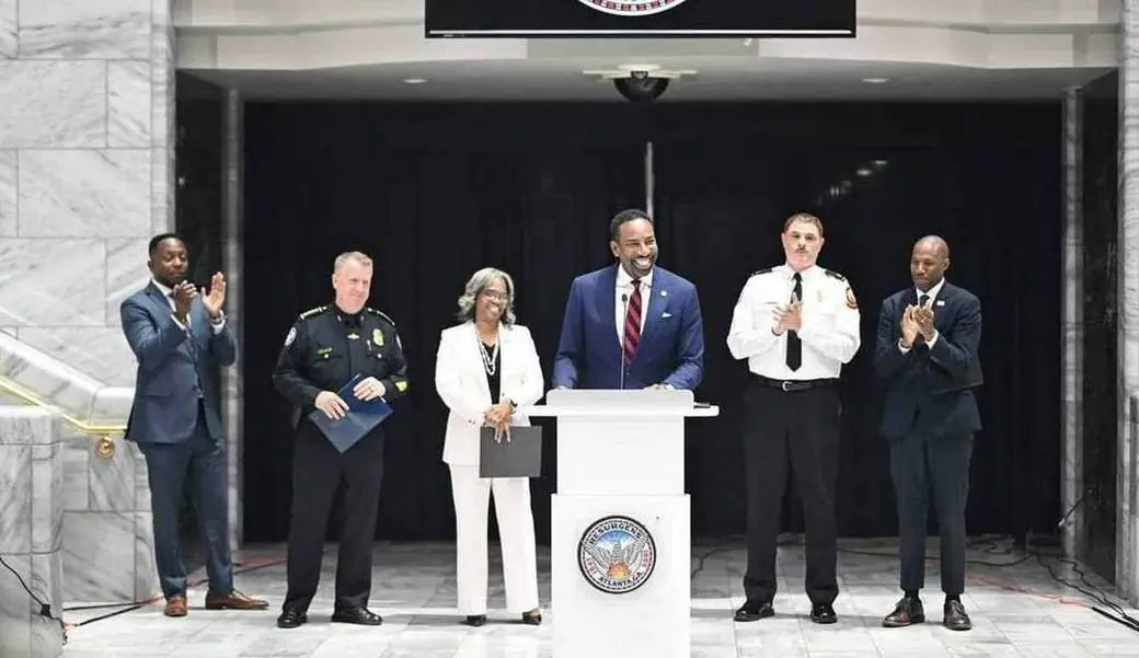 Mayor Andre Dickens and COO LaChandra Burks with City leaders and public-safety partners at a FIFA readiness announcement